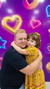 Father hugs daughter with love