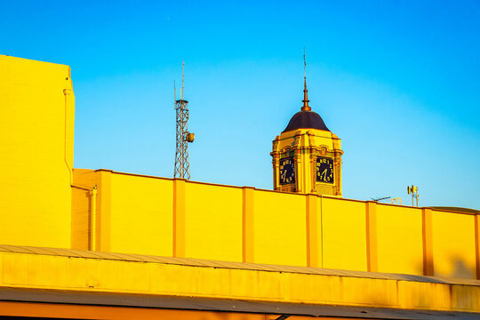 Vintage clock tower glows at Bakersfield sunset