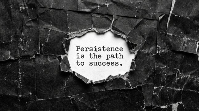 Motivational cracked wall text showing perseverance as the path to success in monochrome