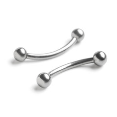 Obraz na płótnie Canvas Two shiny curved barbells, body piercing jewelry made of stainless steel, isolated on a clean white background