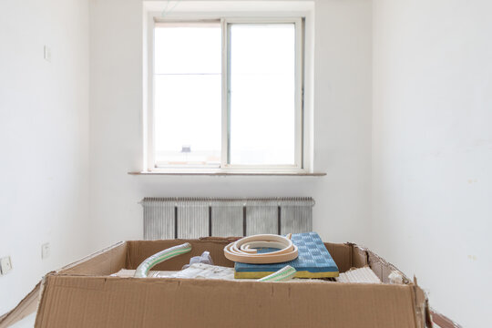 A box of construction waste indoors