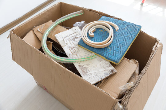 A box of construction waste indoors