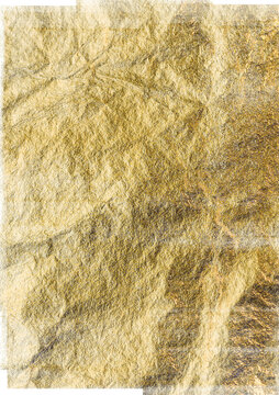 Abstract textured crumpled background with shimmering gold metallic foil