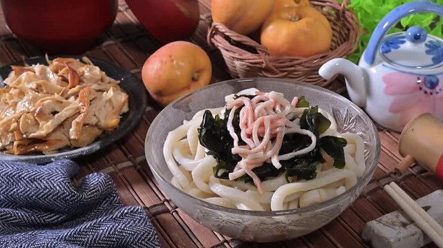 Cold udon noodles in glass bowl   