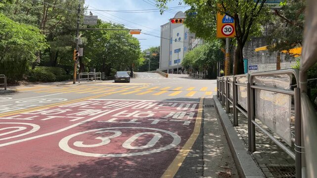 Pedestrian Crossing 30 kmh School Zone Road with Red Pavement