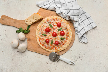 Fototapeta premium Tasty pizza, cutter and ingredients on light background