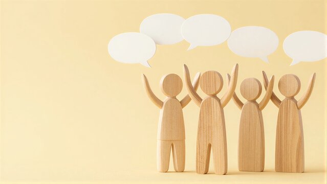 Wooden figures with speech bubbles symbolize group communication and collaboration.