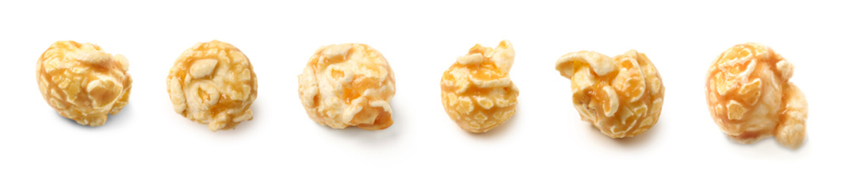 Six individual caramel popcorn kernels with sweet glaze, isolated on a clean white background for snack and dessert concepts
