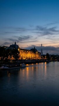 Illuminated building and river at twilight