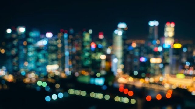 雪のように舞うカラフルな円形ボケが、光り輝く抽象的な都市の夜景を形成するマクロ映像。