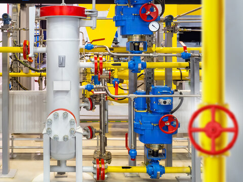 Gas distribution station. Industrial gas pipeline equipment with valves, pressure gauges and control units for natural gas distribution, monitoring and energy infrastructure.