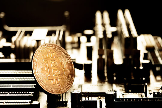 BTC bitcoin Cryptocurrency coin show on PC computer circuit motherboard. Concept for crypto currency, mining, technology, investment, finance, national bank reserve