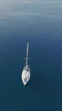 Aerial Anchored Sailboat in Blue Aegean Sea Halkidiki Greece