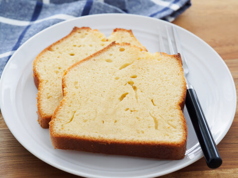 Title: "Pound Cake Slices on Wooden Table with Linen Napkin