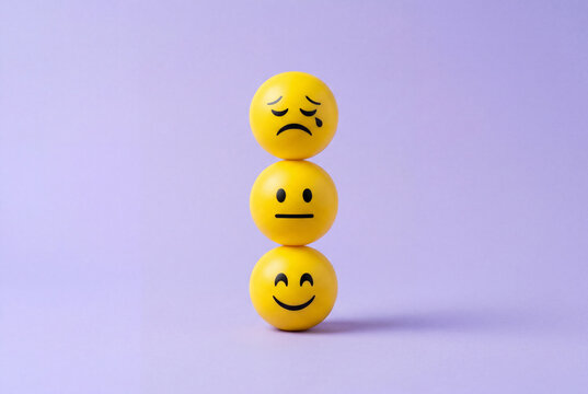 A vertical stack of three yellow emoji balls showing different emotions on a purple background