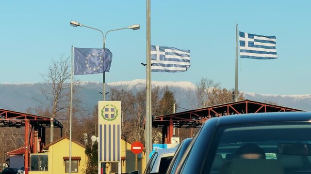 Waving Greek and EU Flags at the Thessaloniki Border Crossing
