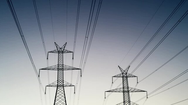 Electric Powerline Pylons Silhouette at Sunset in Thessaloniki Greece