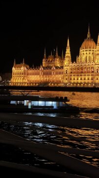 Budapest Parliament at Night with Boat on Danube River