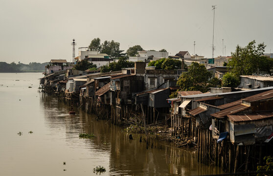 Poor shoddy houses on a river in Vietnam