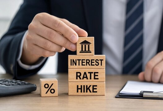 Professional placing wooden blocks to illustrate an interest rate hike by central bank during business meeting