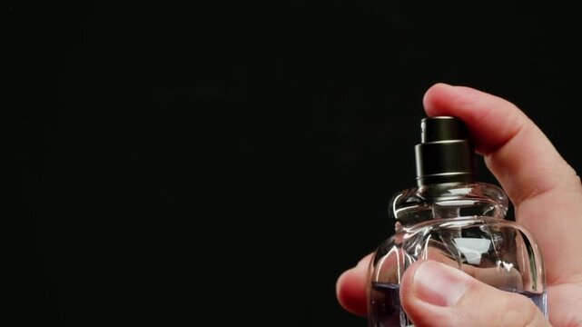 Luxury Cologne Spray Applied by Young Man Close Up