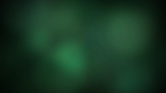 Dark green blurred abstract background with subtle light gradients, concept for ambient lighting, mysterious mood and digital art