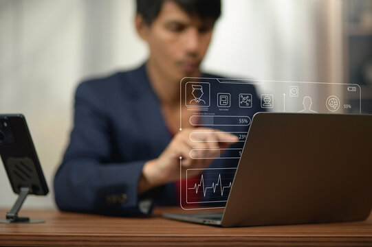 Businesswoman Analyzing Data and Using Digital Devices in Office Environment
