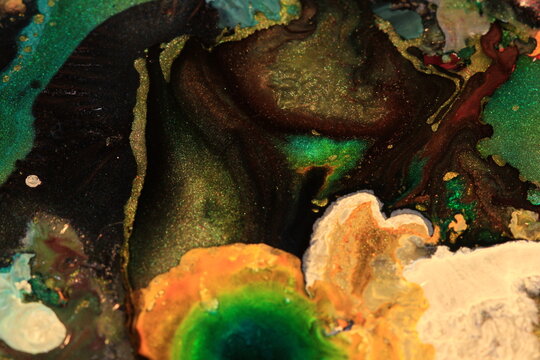 Inks, oil, water and mica powders create these cool abstract images.