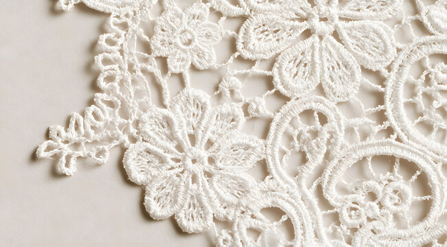 A plain background featuring a floral motif and adorned with an elegant white lace corner