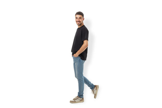 Man stands casually in a black t-shirt and jeans, PNG