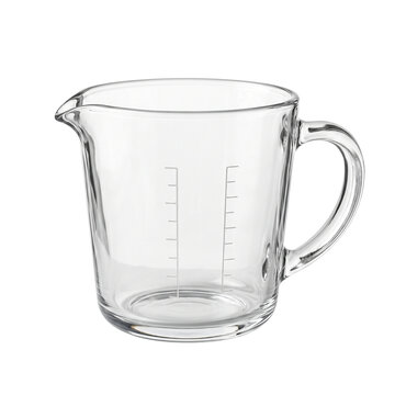 Clear glass measuring cup with handle and spout. Transparent kitchen jug with measurement scale. Empty glass pitcher for cooking and baking.