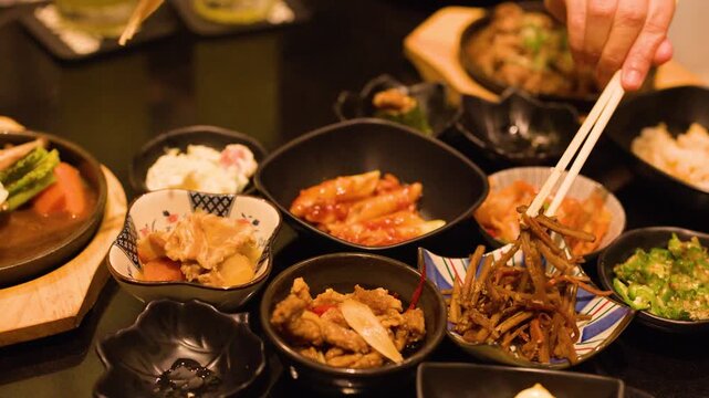 Japanese Cuisine Side Dishes and Banchan Served in Black Bowls