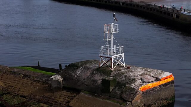 Aerial view, small navigation beacon on the harbour wall at Ayr Harbour, Scotland, marking the edge of the waterway within the working port