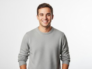 Obraz premium Young man smiling and holding a tablet in casual clothes