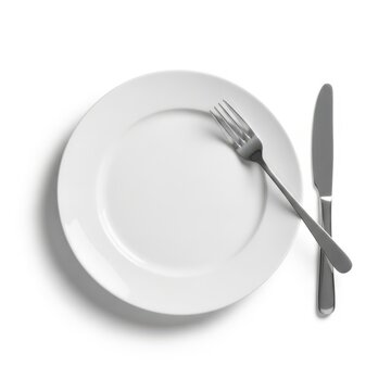 Empty plate with fork and knife isolated on white background