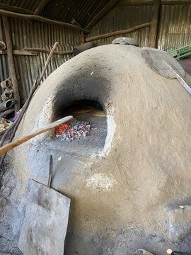 Traditional Moroccan Clay Bread Oven Farran with Fire and Baking Flatbread