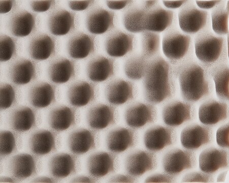 Closed-cell case foam with a pitted tactile surface and soft grey tones, creating a protective padding background for packaging design