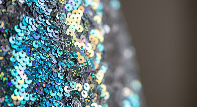 Close-up of Shimmering Multicolored Sequins on Fabric Surface