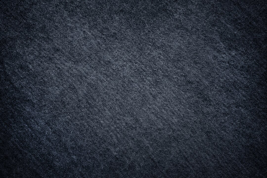 Dark grey stone / black slate stone background or texture