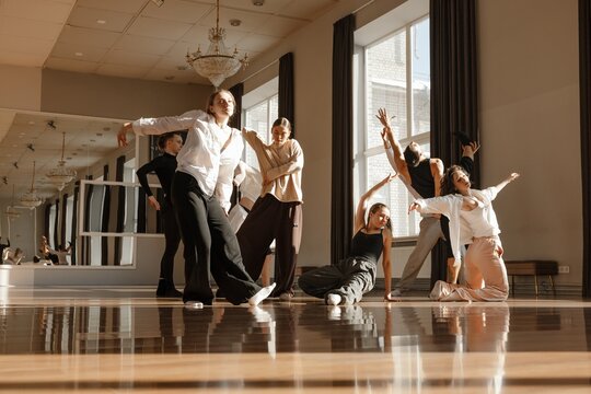 Group of dancers practicing dance in a contemporary dance studio