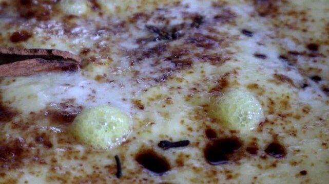 Close up view of pineapple jam when it's thickening with cinnamon and cloves. Best for hobby, cooking, activity at home, advertisement and commercial themes.