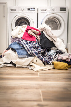 Pile of dirty clothes in laundry room