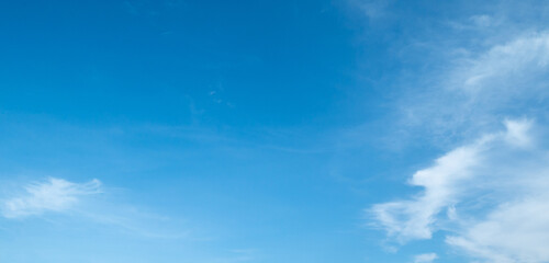 Fototapeta premium Beautiful blue sky with white clouds on a sunny day background