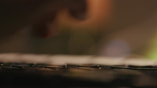 Close‑up of human hands typing on mechanical keyboard, office workspace background, computer work footage