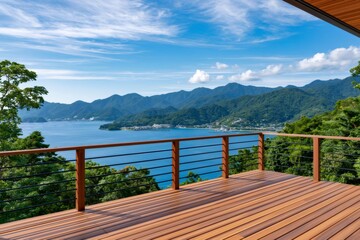 Fototapeta premium Wooden deck overlooking tranquil bay and green mountains