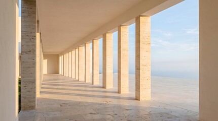 Naklejka premium Modern travertine colonnade with repeating columns and long afternoon shadows.