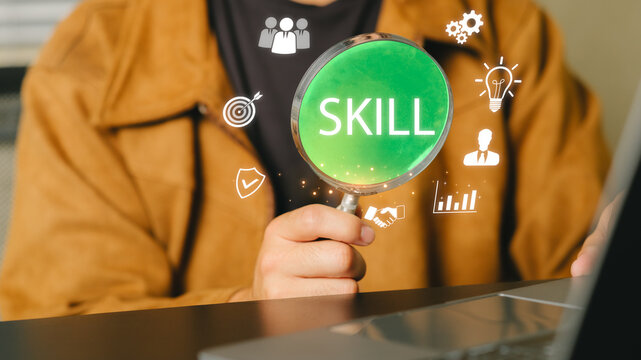 Professional person holding a magnifying glass with skill text and icons in a digital environment