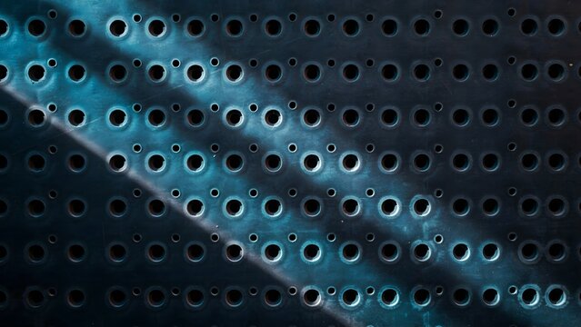 Textured Metal Surface with Circular Holes and Light Reflection
