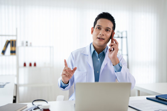 Doctor engaging in a phone conversation in professional clinic environment. TeleHealth