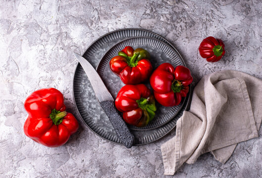 Fresh ripe sweet bell pepper on grey background